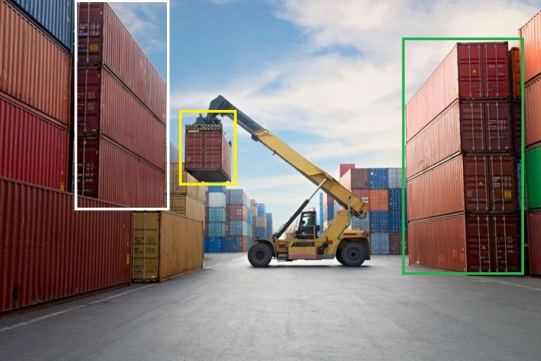 Crane lifting up container in a port.